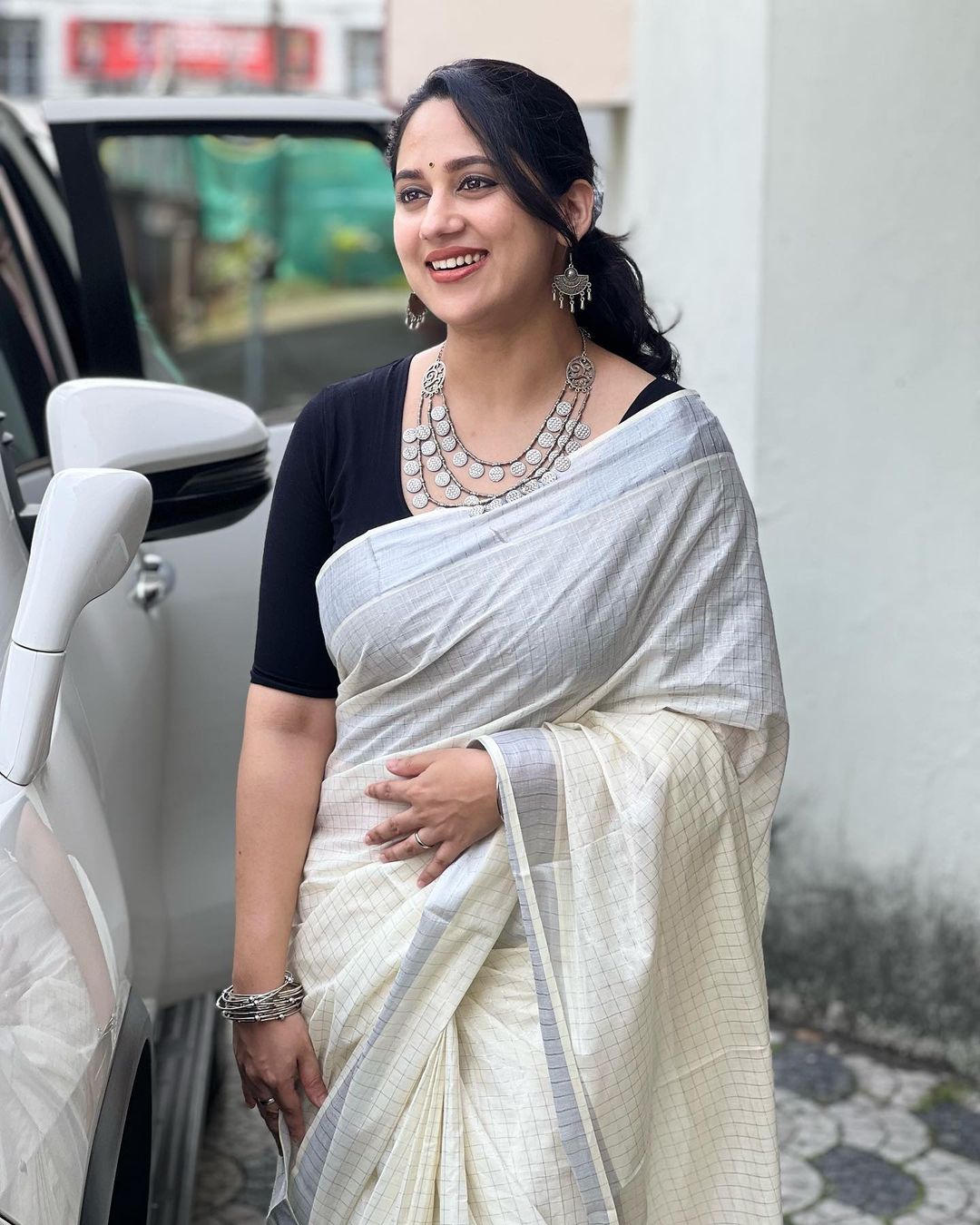 malayalam actress miya george stills in white saree black blouse